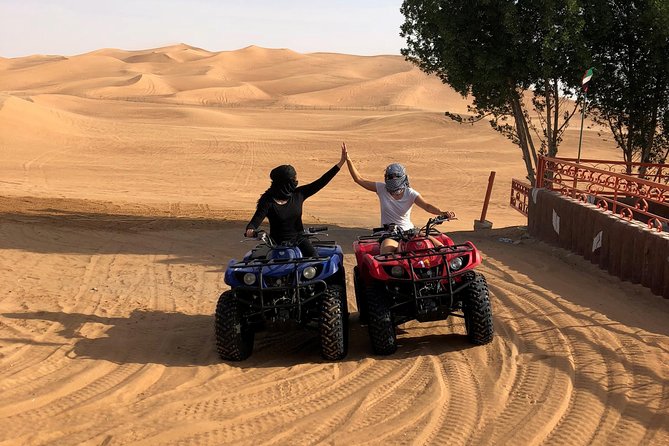Dubai: Unique SUNSET Quad Bike Red Dunes Safari - Key things to know before booking