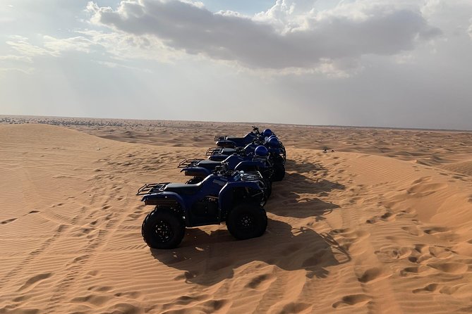 Dubai: Unique SUNSET Quad Bike Red Dunes Safari - Dinner, henna, and shows at the traditional camp