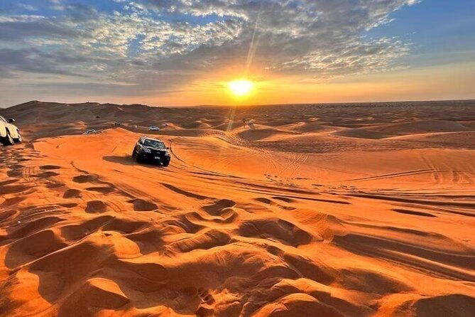 Early Morning Desert Safari With Camel Trekking Experience - Sunrise over the red dunes