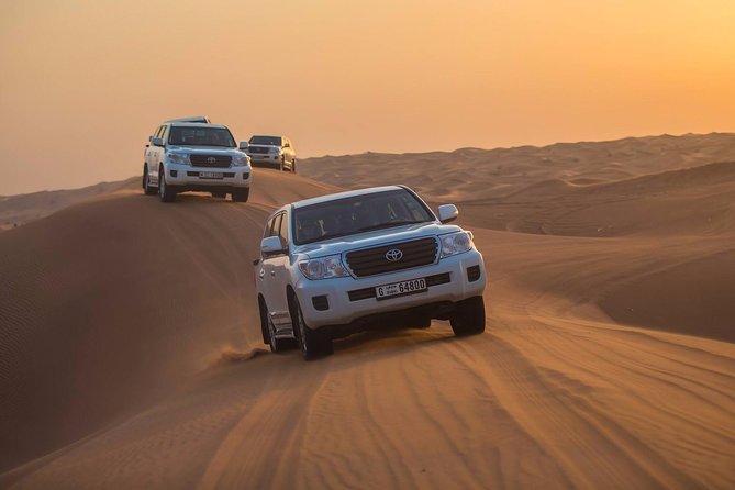 Evening Desert Adventure: Quad Biking, Sandboarding & Camel Ride - Sandboarding and desert photo stops