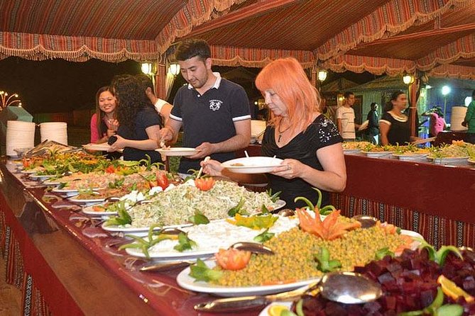 Evening Desert Adventure: Quad Biking, Sandboarding & Camel Ride - BBQ dinner, drinks, and the night show