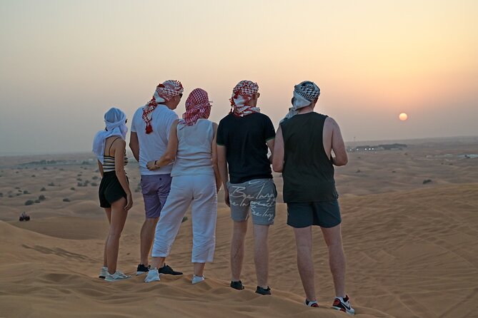 Evening Desert Safari in Dubai, Sandboard & BBQ Dinner - Sandboarding, quad bikes, and the short camel ride