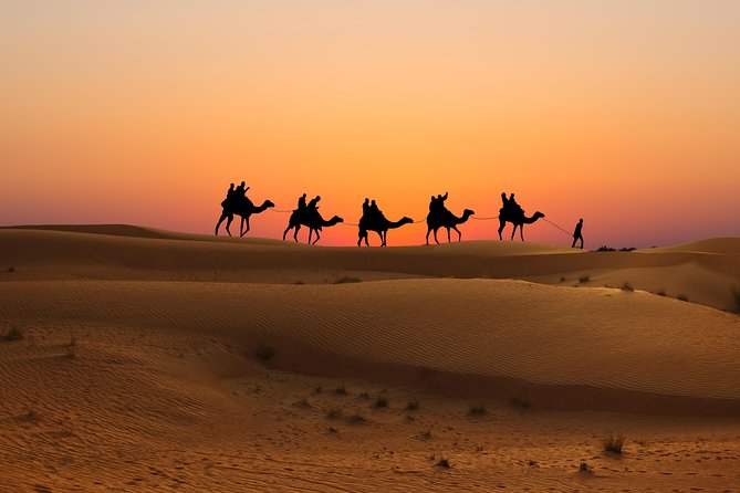 Evening Desert Safari in Dubai, Sandboard & BBQ Dinner - The Bedouin-style camp after sunset