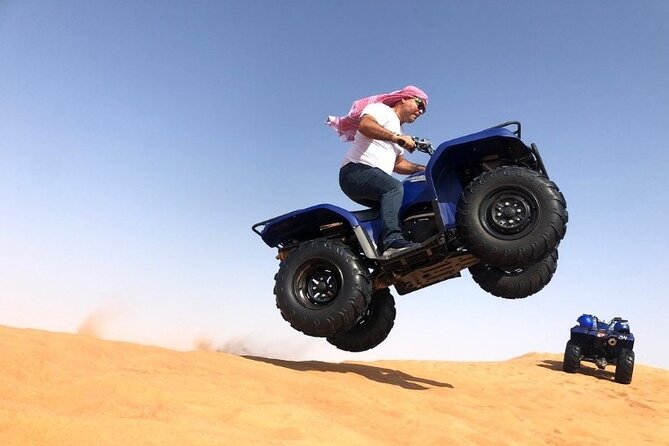 Evening Desert Safari with ATV Quad Bike Dune Bashing BBQ Dinner - Reaching the camp after sunset