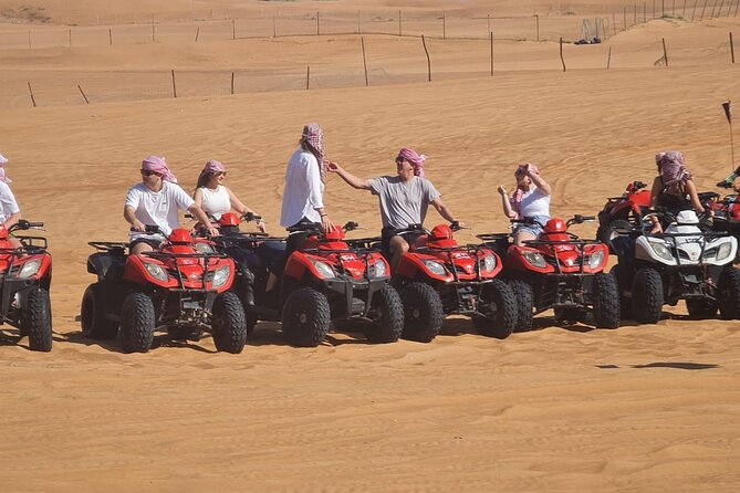Evening Desert Safari with BBQ Buffet Camel Ride and Arabic Shows - A short camel ride and sandboarding near camp