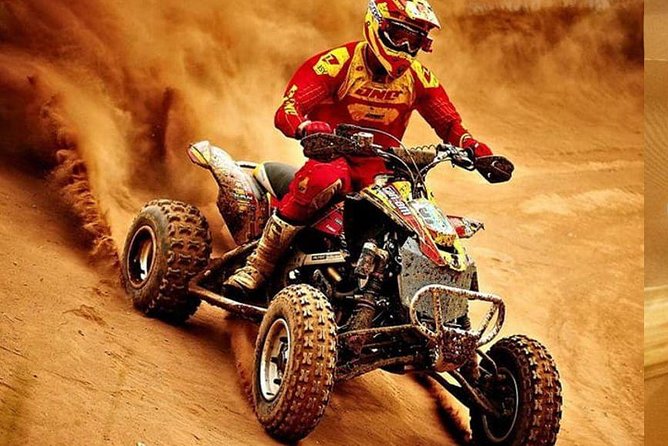 Evening Desert Safari with BBQ Dinner & self-drive Quad biking - A camp with henna, sandboarding, and evening activities