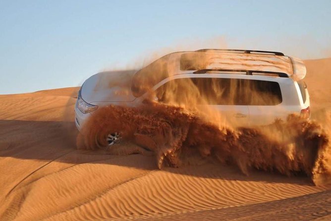 Evening Desert Safari with Camel Ride, BBQ Dinner and Dune Bashing - Dune bashing across the Lahbab sands