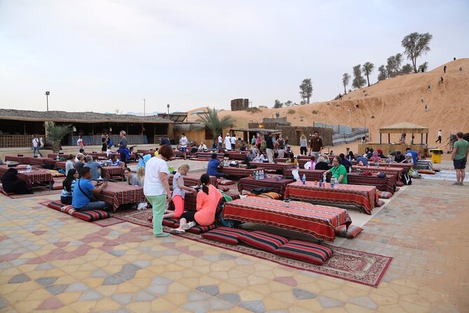Evening Desert Safari with Camel Ride, BBQ Dinner and Dune Bashing - Camel ride, Arabic coffee, and Bedouin-style camp welcome