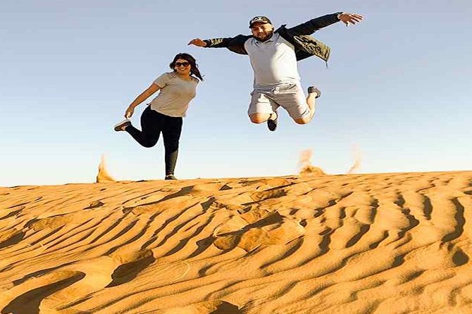 Evening Desert Safari with, Dune Bashing, Camel Ride, sand board - Camel riding gives the safari a traditional touch