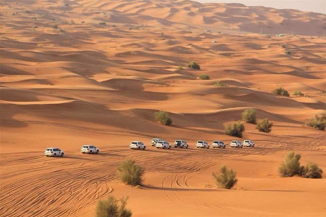 Evening Red Dunes Desert Safari: BBQ Dinner & Adventure Awaits! - Sandboarding, camels, and the sunset pause