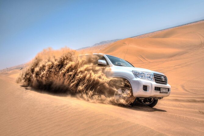 Evening Red Dunes Safari with Quad Biking, BBQ Dinner & LiveShows - Belly dancing, Tanoura, and fire performances