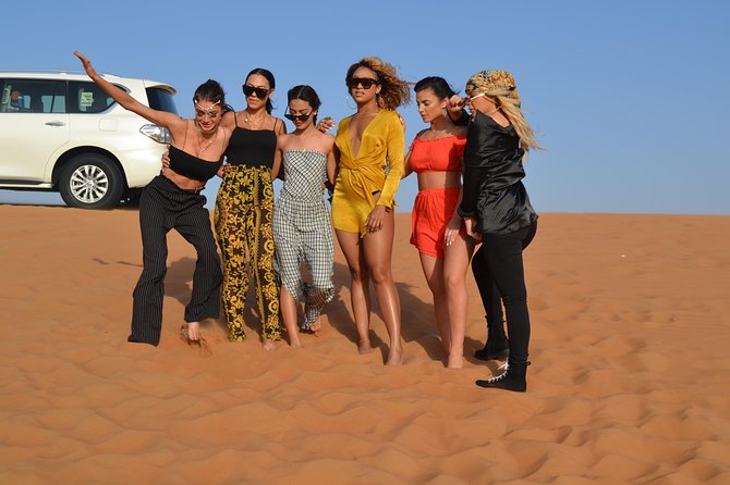Exclusive private vehicle, front table, food served by Buttler - Lahbab’s red dunes and the 25-minute thrill ride