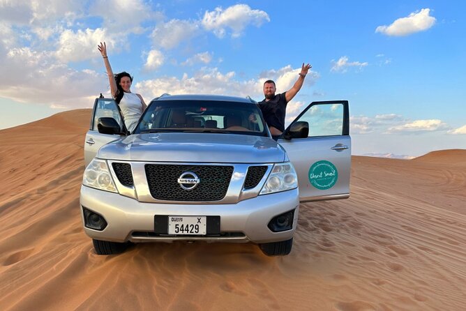 Experience the Ultimate Dubai Red Dunes Desert Safari BBQ Dinner - Sandboarding, camels, and the falcon photo stop