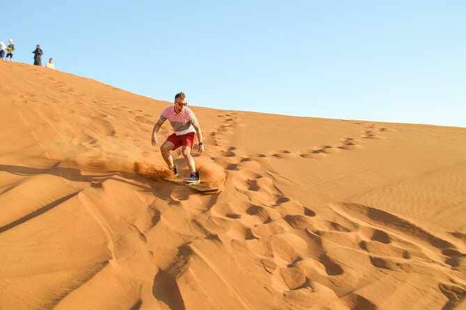 Full-Day Guided Red Dunes Desert Tour in Dubai with Camel Ride - Buffet dinner and seven evening shows