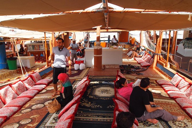 Full-Day Mussandam Cruise with Lunch Dibba - Boarding the wooden dhow in Dibba
