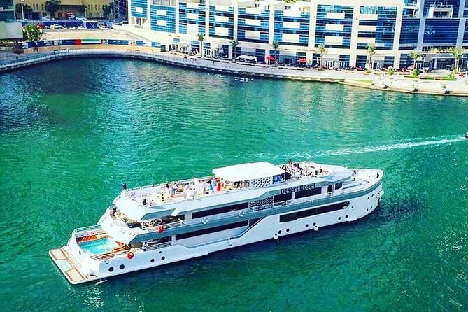 Luxury 7 Star Mega Yacht Dinner Cruise with International Buffet - Sailing through Dubai Marina after dark