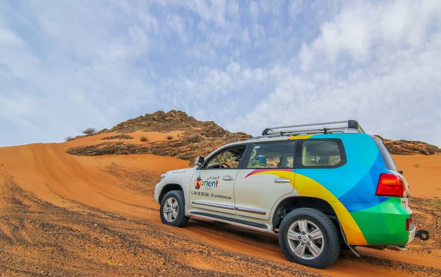 Mleiha Desert Safari with Sandboarding, Stargazing & Dinner - Sunset views, rocks, and the archaeology center