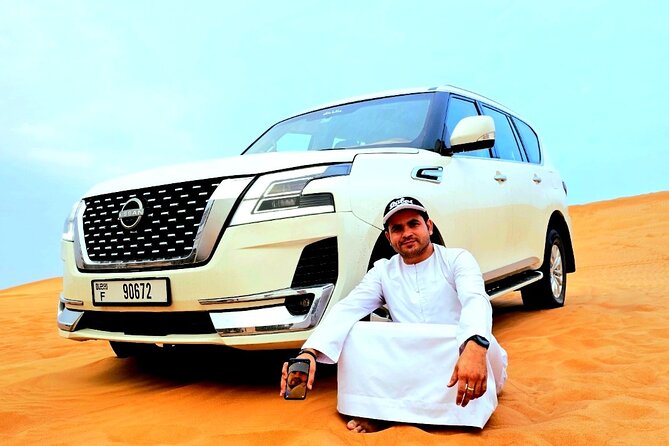 Morning Desert Safari in Dubai with Quad Bike and Camel Ride - Sand boarding from a high dune