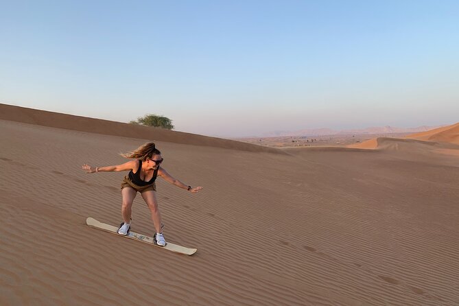 Morning Desert Safari, Quad Bike, Sandboard and Camel Ride - Dune bashing across the Lahbab red dunes