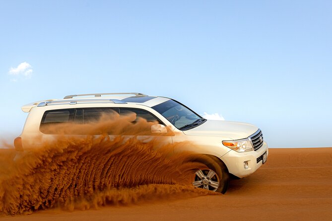 Morning Desert Safari, Quad Bike, Sandboard and Camel Ride - Sandboarding and the desert photo stop