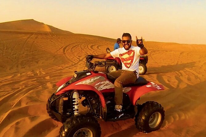 Morning Desert Safari with Quad Bike, Camel Ride & Sandboarding - Camel riding: brief, traditional, and possibly shared
