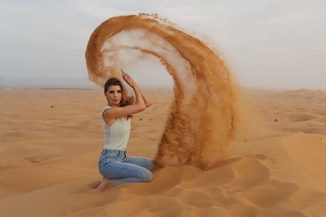 Morning Dune Bashing with Camel Trekking and sand boarding - Sandboarding down the tall red dunes