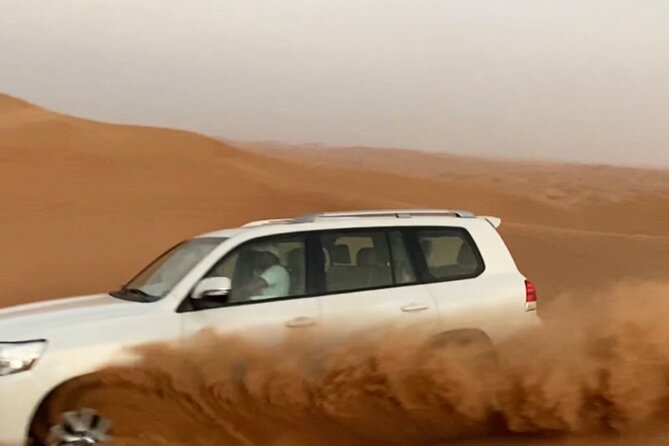 Morning Red Dune Safari with Sandboarding and Camel Ride - Reaching Lahbab in an air-conditioned 4x4