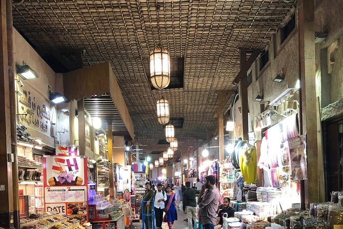 Old Dubai Walking Tour: Abra ride, Creek, Spice & Gold Souks. - What the guide adds to the shopping experience