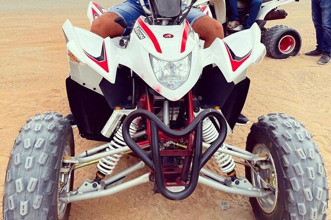 One hour Quad Bike at Red Sand Desert Safari with Camel Ride and BBQ Dinner - Key points at a glance