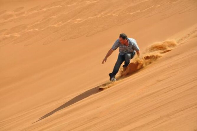 Polaris 570cc (4x4 )Quad Bike Ride +Sand Boarding- Red Dunes - A 15-minute camel ride gives the day a traditional pause