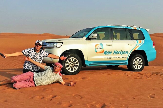 Premium Red Dune Safari, Sandboarding, Camel Ride, 5<em> BBQ Dinner – Key points to know before booking’ /></p>
<ul>
<li><strong>The red dunes are the visual highlight:</strong> Al Madam offers striking orange sand and good sunset photo opportunities.</li>
<li><strong>The 4×4 ride is the main thrill:</strong> Expect a proper sand drive, not simply a road transfer to a camp.</li>
<li><strong>Sandboarding is included:</strong> You receive guidance, so beginners can try it without arranging a separate activity.</li>
<li><strong>The camp adds cultural touches:</strong> Camel rides, henna, traditional clothing, shisha, food, and performances fill out the evening.</li>
<li><strong>Pickup saves time and stress:</strong> Hotel transfers are included, though the drive from central Dubai can be long.</li>
<li><strong>Buggy and quad-bike rides are extra:</strong> They are not included in this package, so check the price before adding them.</li>
</ul>
<h2 id="leaving-dubai-for-al-madams-red-dunes">Leaving Dubai for Al Madam’s red dunes</h2>
<p> BBQ Dinner – Leaving Dubai for Al Madam’s red dunes’ /></p>
<p><p>The tour begins with pickup between roughly 3:00 and 3:30 PM. The exact collection time depends on your hotel or location, but the afternoon schedule is designed to get you into the desert before sunset.</p>
</p>
<p><p>You ride in a 4×4 vehicle toward Al Madam, a desert area known for its tall red-orange dunes. The drive from Dubai can take time, and one past account described a journey of about 75 kilometers from the city. That is worth keeping in mind if you have a short evening or young children who dislike long car rides.</p>
</p>
<p><p>The transfer is not wasted time. As the city thins out, the trip changes from an urban outing into a proper desert excursion. Your driver handles the route, explains what is coming, and helps keep the schedule moving.</p>
</p>
<p><p>Several drivers have been praised for precisely these small services. Ashraf Shobi was noted for explaining the plan, checking on comfort during the dune ride, and stopping for photographs. Sijin was repeatedly described as friendly and attentive, while Javid, known as Jay, was praised for answering questions and keeping the trip organized.</p>
</p>
<p><p>Those details matter. A desert safari involves several handoffs between driving, sandboarding, camel riding, camp activities, and dinner. A helpful guide makes the whole evening feel less hurried.</p>
</p>
<div class="twil" style="margin: 20px 0; padding: 15px 0;"><p>More red dune safaris in Dubai:</p><ul style="margin: 10px 0; padding-left: 0; list-style: none;"><li style="margin: 0 0 12px 0; padding: 0 0 12px 0; border-bottom: 1px solid #eee; line-height: 1.4;"><a href="https://uaetravelreviews.com/dubai-red-dune-safari-quad-bike-camel-ride-bbq-dinner/">Dubai: Red Dune Safari, Quad Bike, Camel Ride, BBQ Dinner</a><br><span style="font-size: 0.82em; color: #555;"><span style="color: #A87A00;">★</span> 4.9 · 32,185 reviews</span></li><li style="margin: 0 0 12px 0; padding: 0 0 12px 0; border-bottom: 1px solid #eee; line-height: 1.4;"><a href="https://uaetravelreviews.com/dubai-red-dunes-atv-camels-stargazing-5-bbq-al-khayma-camp/">Dubai Red Dunes ATV, Camels, Stargazing & 5* BBQ Al Khayma Camp</a><br><span style="font-size: 0.82em; color: #555;"><span style="color: #A87A00;">★</span> 5.0 · 21,620 reviews</span></li><li style="margin: 0; padding: 0; border-bottom: none; line-height: 1.4;"><a href="https://uaetravelreviews.com/dubai-premium-red-dunes-safari-camels-5-bbq-at-al-khayma-camp/">Dubai Premium Red Dunes Safari, Camels & 5* BBQ at Al Khayma camp</a><br><span style="font-size: 0.82em; color: #555;"><span style="color: #A87A00;">★</span> 5.0 · 12,388 reviews</span></li></ul></div><h2 id="the-30-to-45-minute-4x4-dune-drive">The 30 to 45 minute 4×4 dune drive</h2>
<p><img width="669" height="446" decoding="async" src=