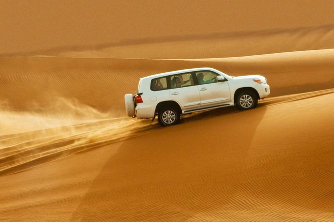 Private Desert Safari Red Dunes with BBQ,Camel Ride,Sand Boarding,Live Shows - Lahbab and the red sand setting