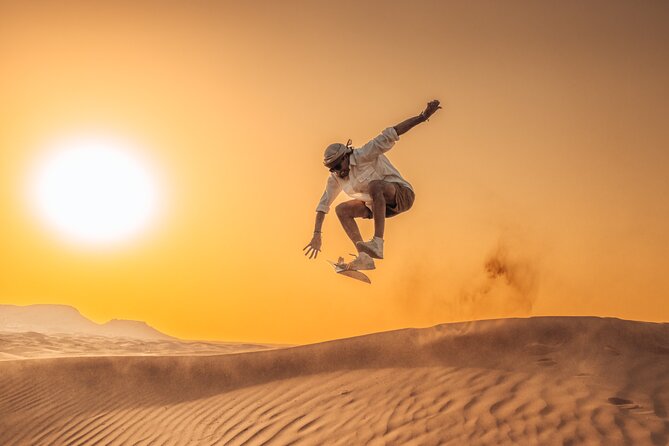 Private Sunset Desert Safari:SandSurfing, Camel Ride & BBQ dinner - Sunset photographs and sandboarding on the slopes