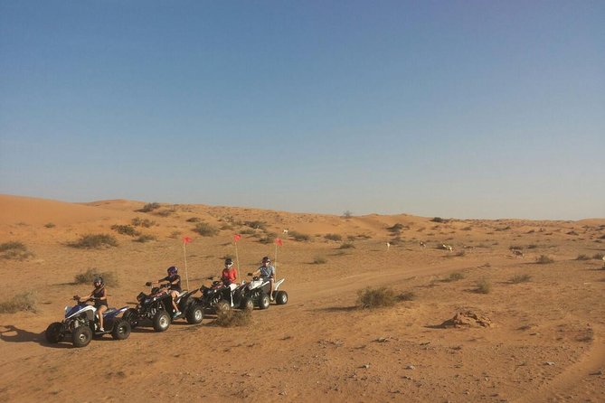 RAK Quad Bike Tour with Return Transfer - A Brief Camel Ride at Camp