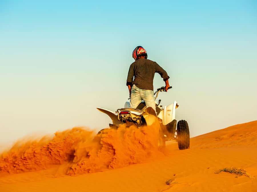 Ras Al Khaimah: Guided Quad Bike Tour - Riding through Ras Al Khaimah’s red dunes