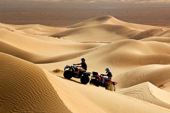 Red Dune Desert Safari Tour with Camel Ride & BBQ Experience - Leaving Dubai behind for the red dunes