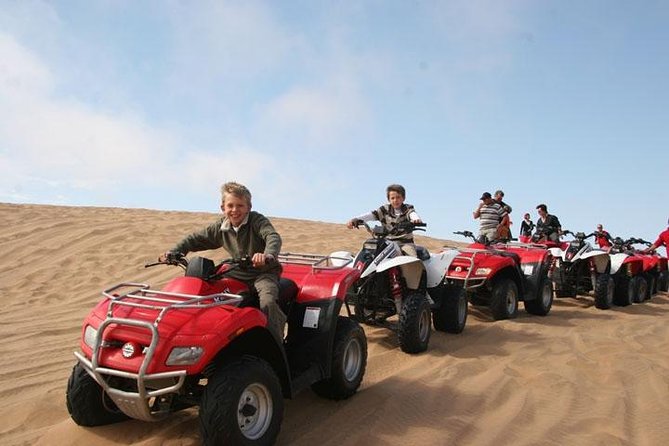 Red Dune Safari with Quad Bike Sand Boarding and Camel Ride - Sandboarding is simple, fun, and more tiring than it looks