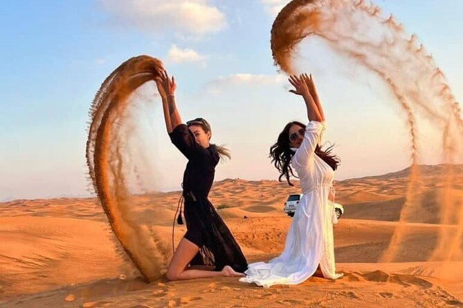 Red Dunes Desert Safari 4x4 Pickup & Drop, Camel Ride BBQ & Shows - Camel ride and sandboarding at the camp