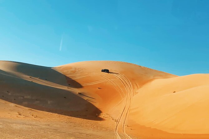 Red Dunes Desert Safari Dubai with BBQ Dinner & Sand Adventure - Leaving Dubai for the red dunes