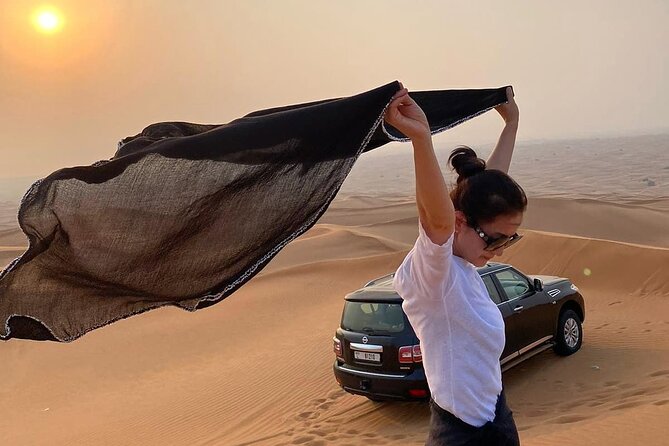 Red Dunes Desert Safari Dubai with Dinner Buffet, Show & Transfer - Dinner, carpets, pillows, and desert-stage entertainment