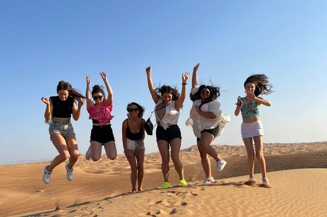 Red Dunes Desert Safari Dubai with Dinner Buffet, Show & Transfer - Sandboarding and a short camel ride
