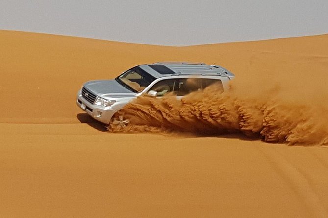 Red Dunes Desert Safari with BBQ Dinner - Red dunes, 4WD thrills, and sandboarding