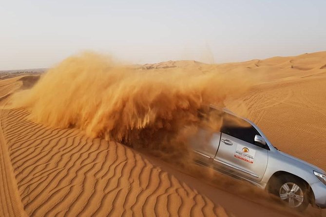 Red Dunes Desert Safari with BBQ Dinner - Belly dancing, fire, and Tannura performances