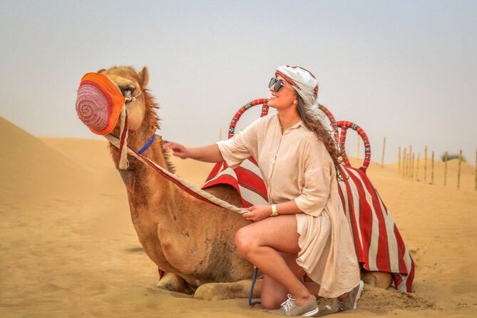 Red Dunes Desert Safari with BBQ Dinner, Camel Riding & Live Show - Belly dancing, tanura, and fire performance