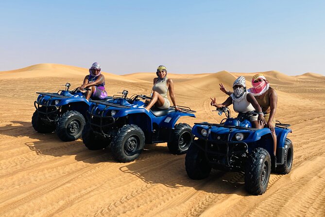 Self Drive Quad Bike in Open Desert With Sand Boarding and Camels - A four-hour desert outing from Dubai