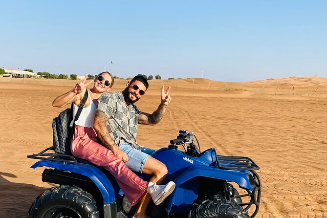 Self Drive Quad Bike in Open Desert With Sand Boarding and Camels - One hour on a self-drive quad bike