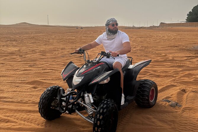 Sunrise Desert safari With Quad bike ride Sandboard & Camel ride - Dune bashing in a Land Cruiser