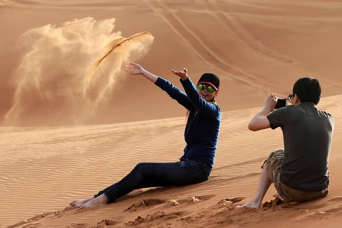 Sunset Camel Trek & Red Dunes Safari with BBQ at Al Khayma Camp From Dubai - Sunset photos, sandboarding, and the optional quad bike