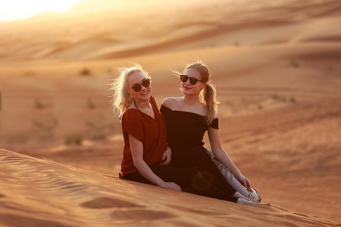 Sunset Camel Trek & Red Dunes Safari with BBQ at Al Khayma Camp From Dubai - Belly dancing, tanoura, and the fire show