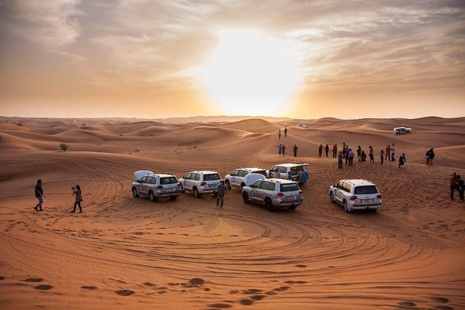 Sunset Desert Safari With BBQ Dinner, Camel Ride, Belly Dancing from Dubai - Camel riding, henna, and Arabic coffee at the camp